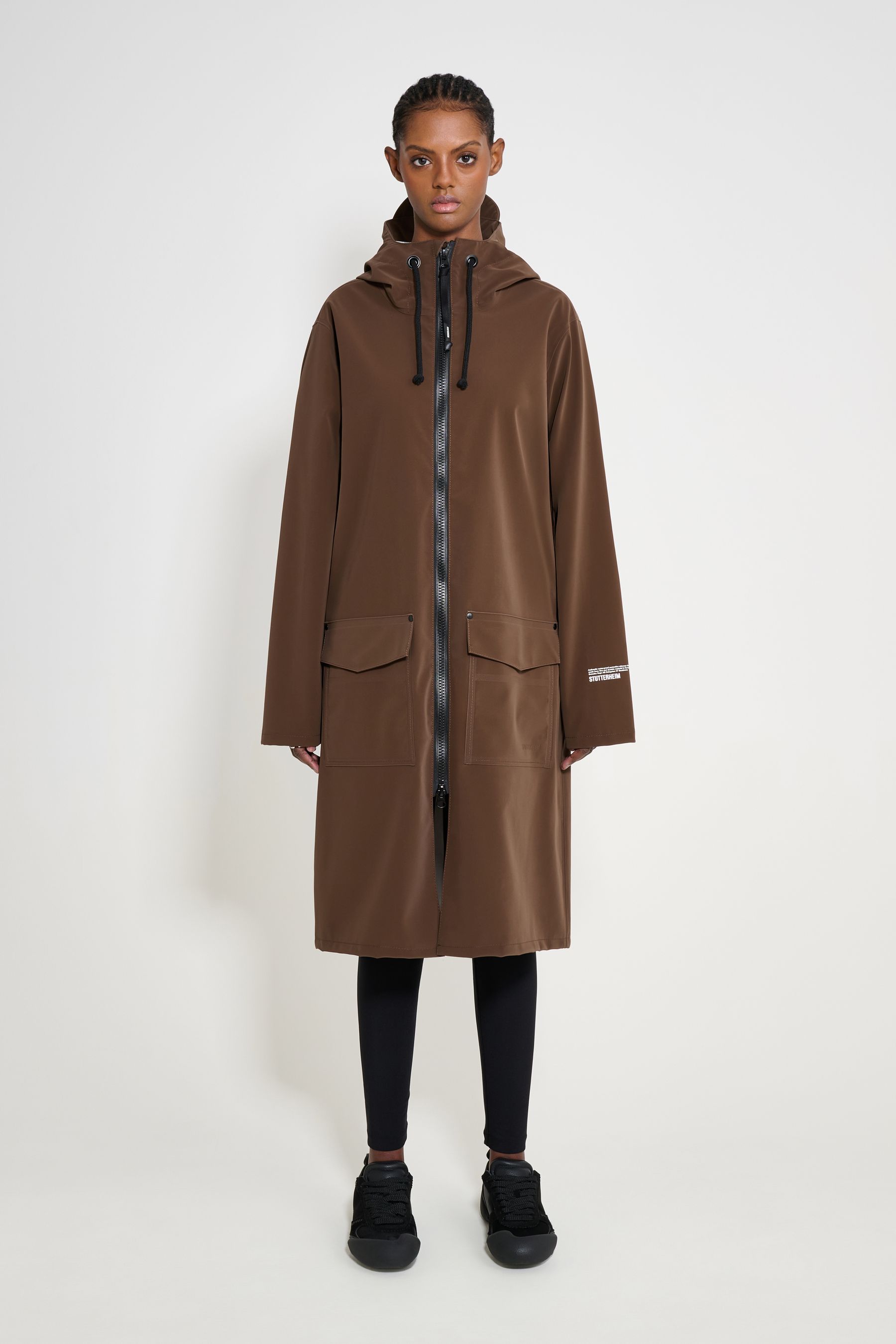stutterheim stockholm long patch raincoat dark brown women jackets long-raincoats