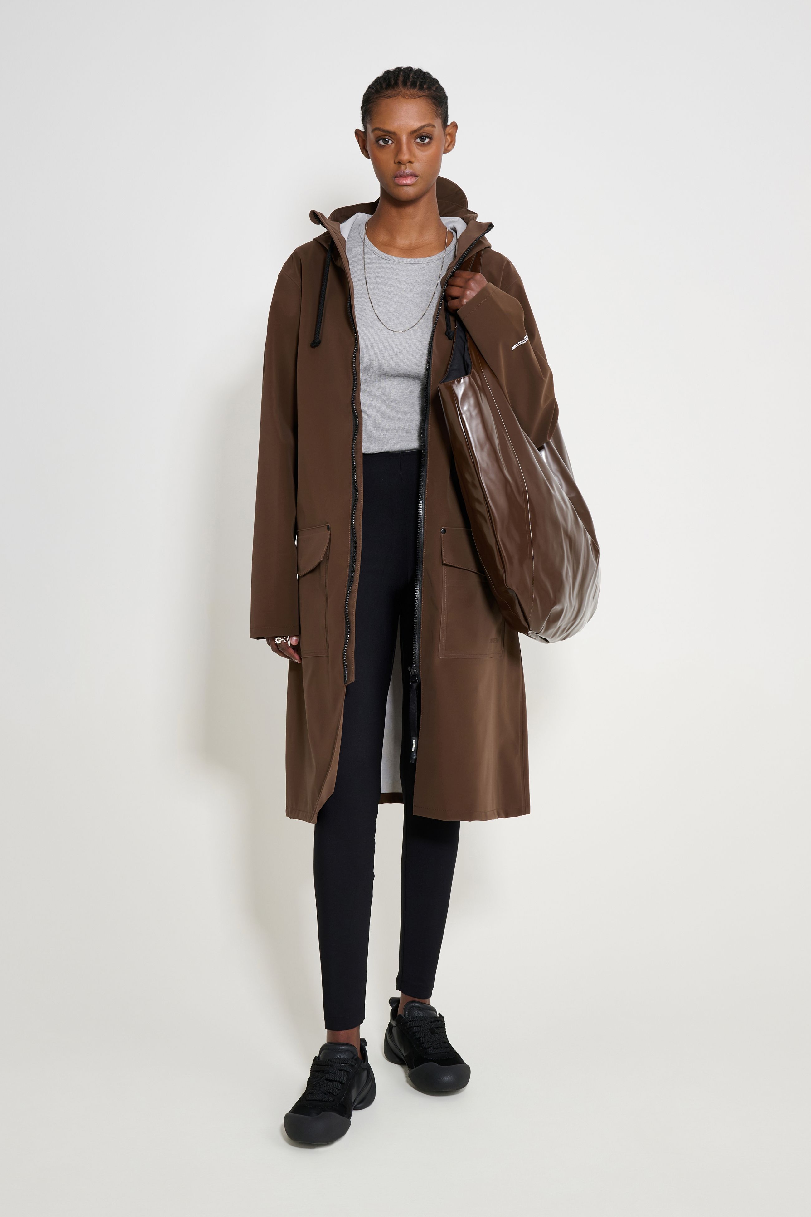 stutterheim stockholm long patch raincoat dark brown women jackets long-raincoats