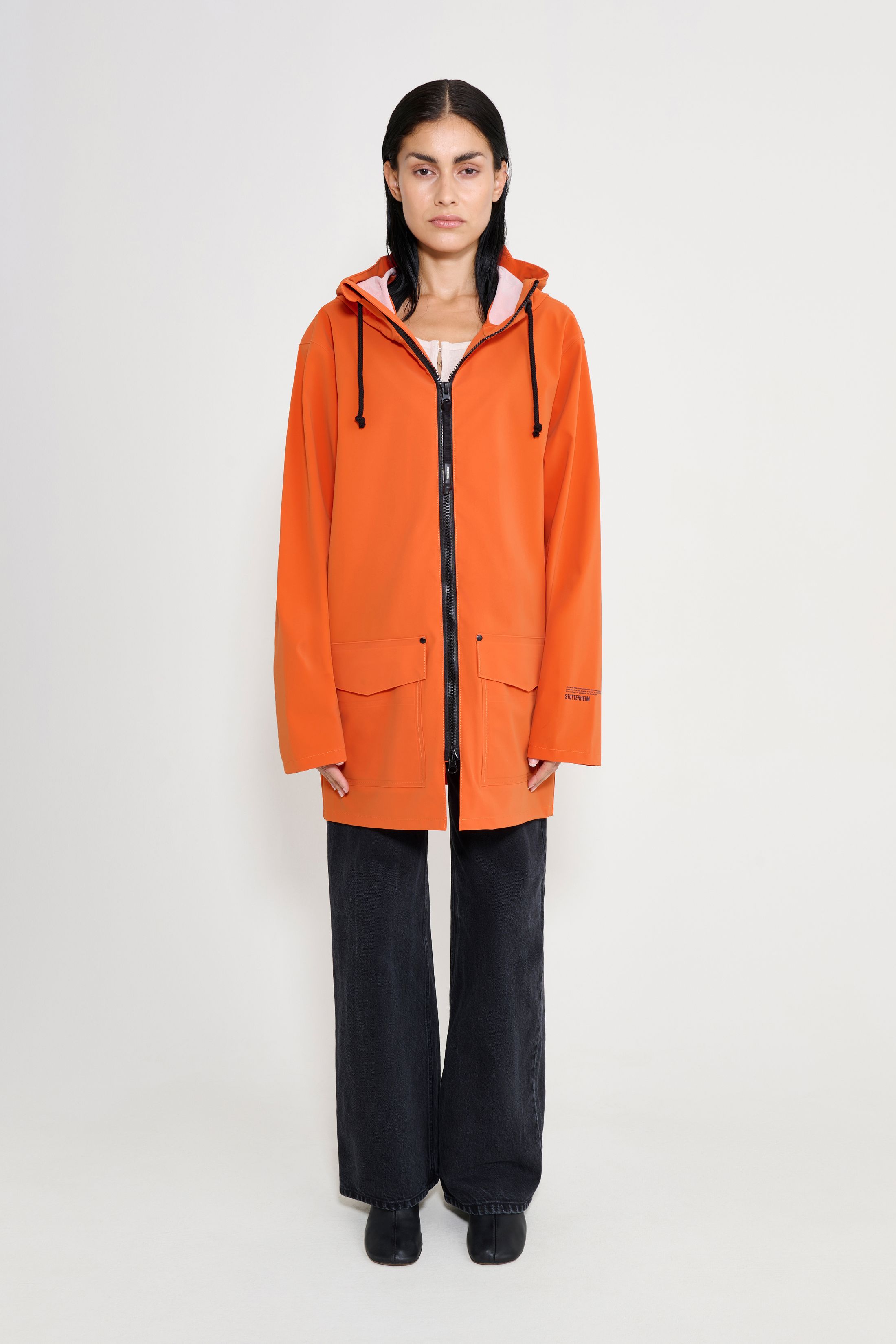 stutterheim stockholm patch matte pumpkin women jackets raincoats