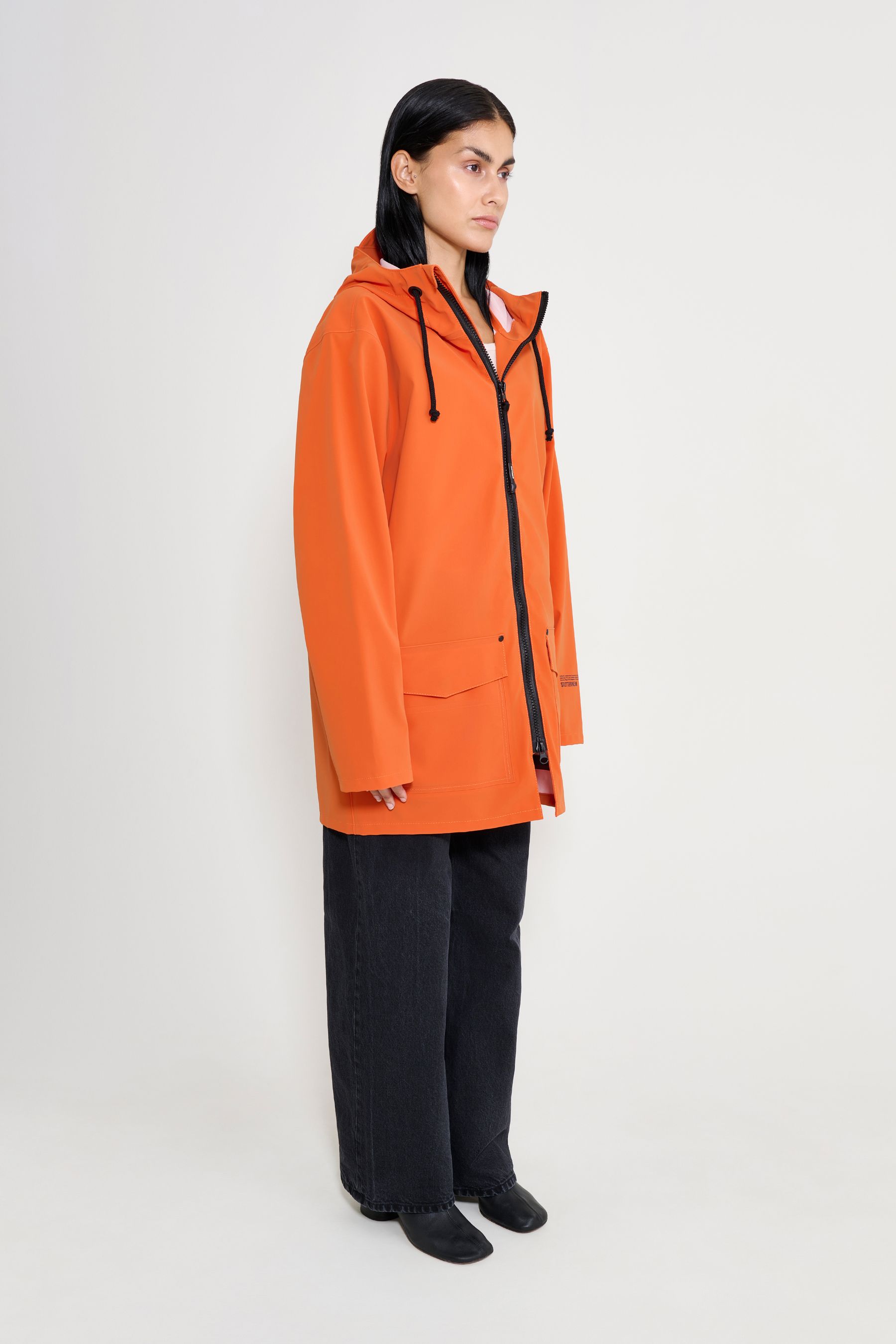stutterheim stockholm patch matte pumpkin women jackets raincoats