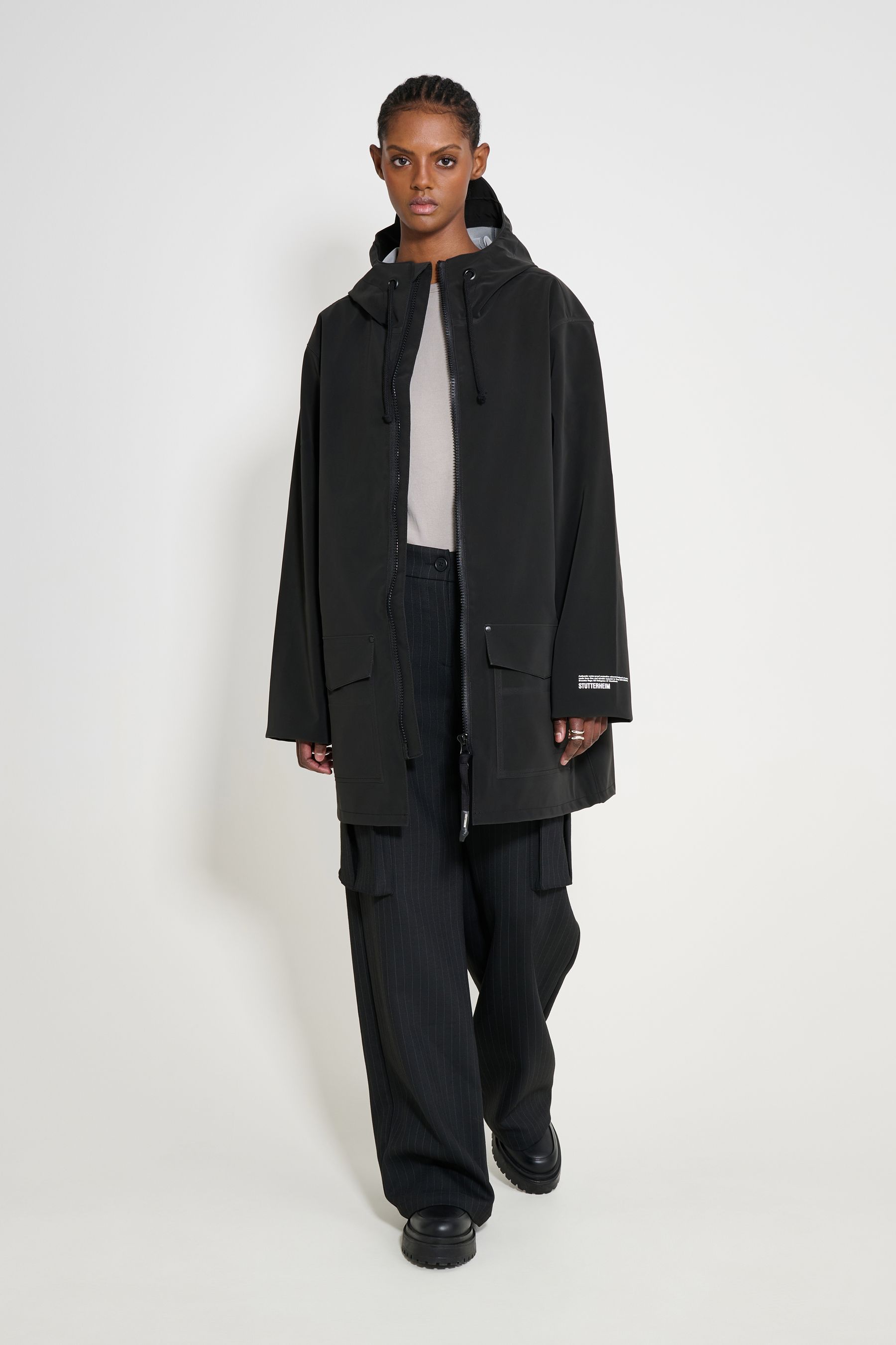 stutterheim stockholm patch raincoat black women jackets