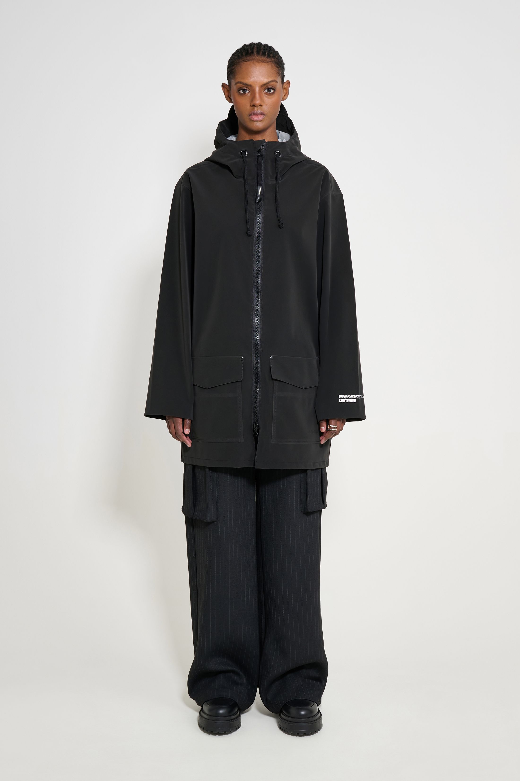 stutterheim stockholm patch raincoat black women jackets